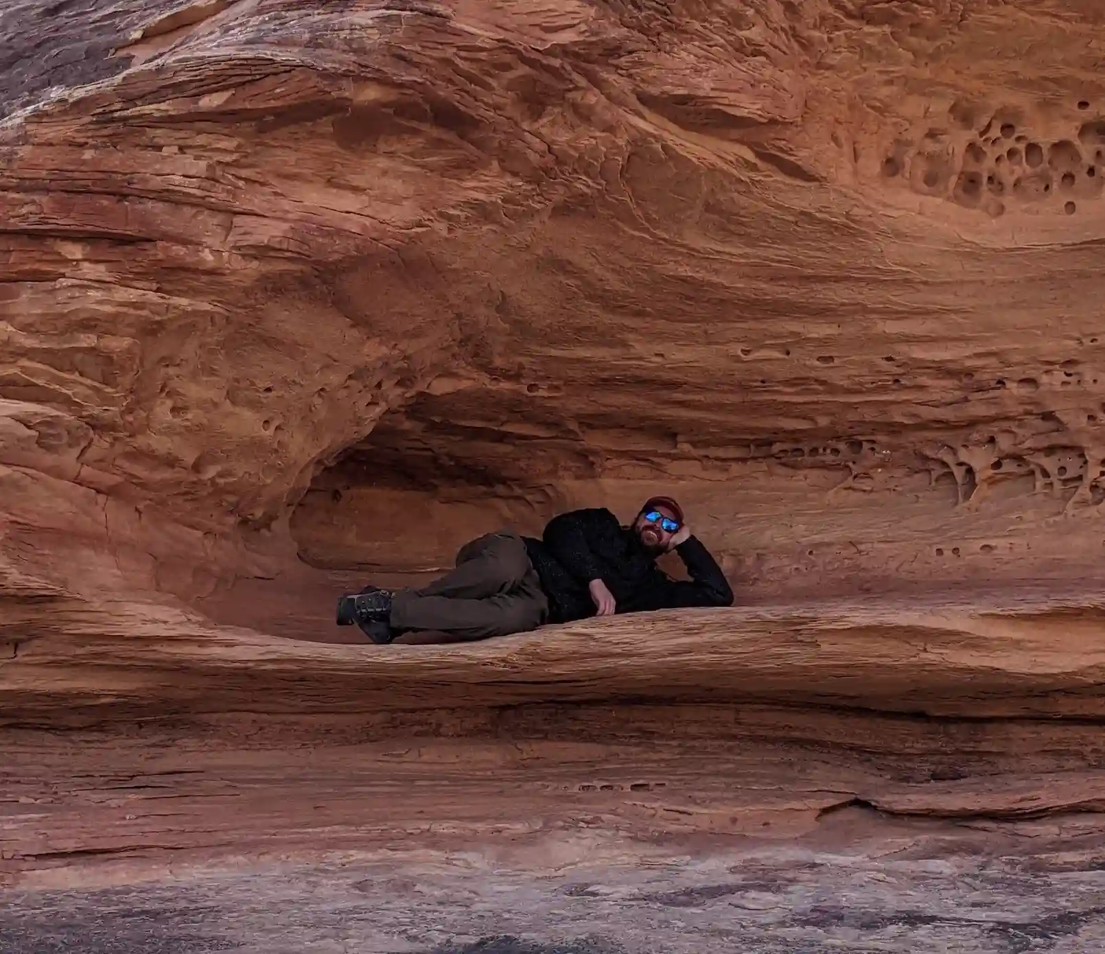 Team member exploring red rock canyon